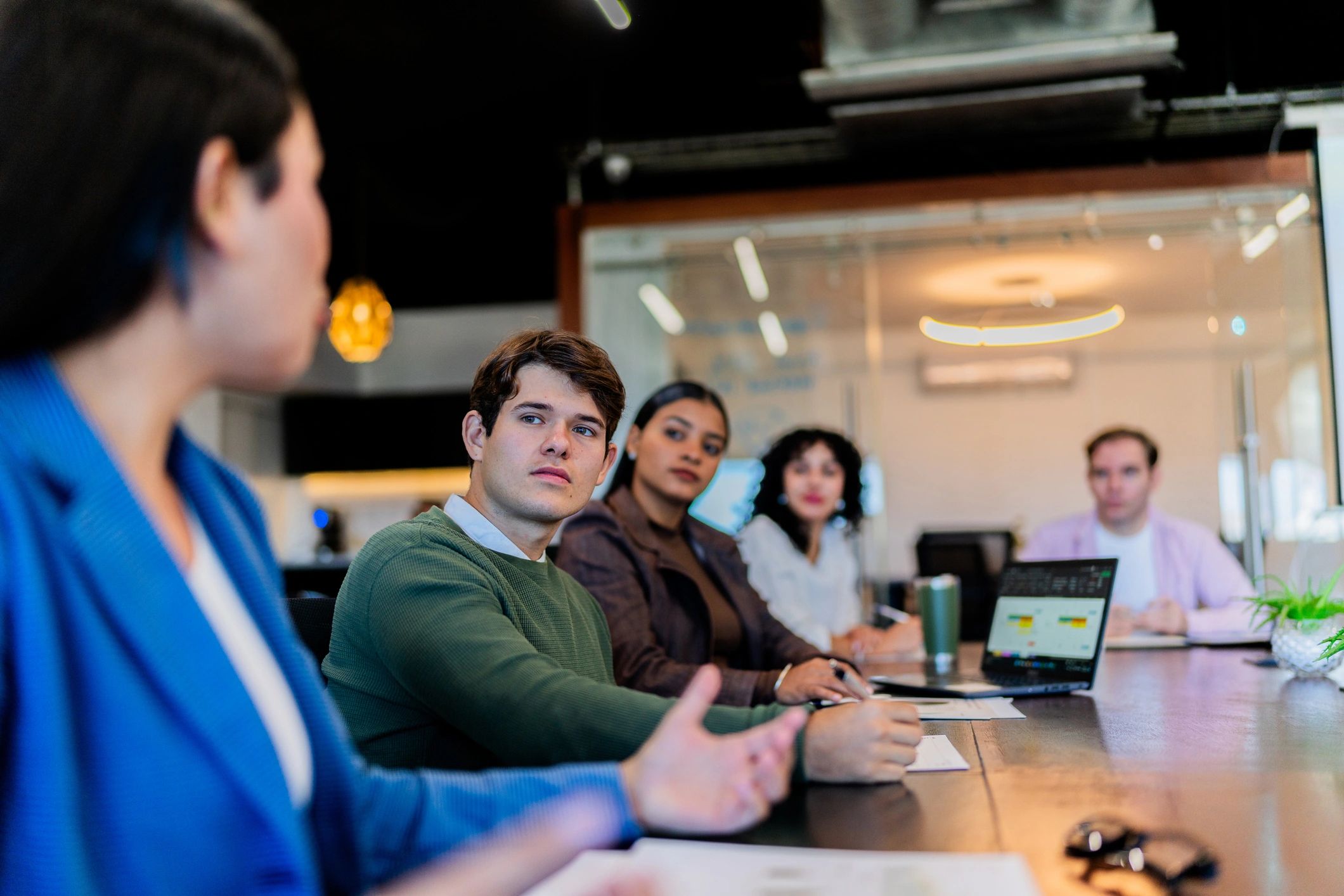 Professionals in a finance-focused business meeting